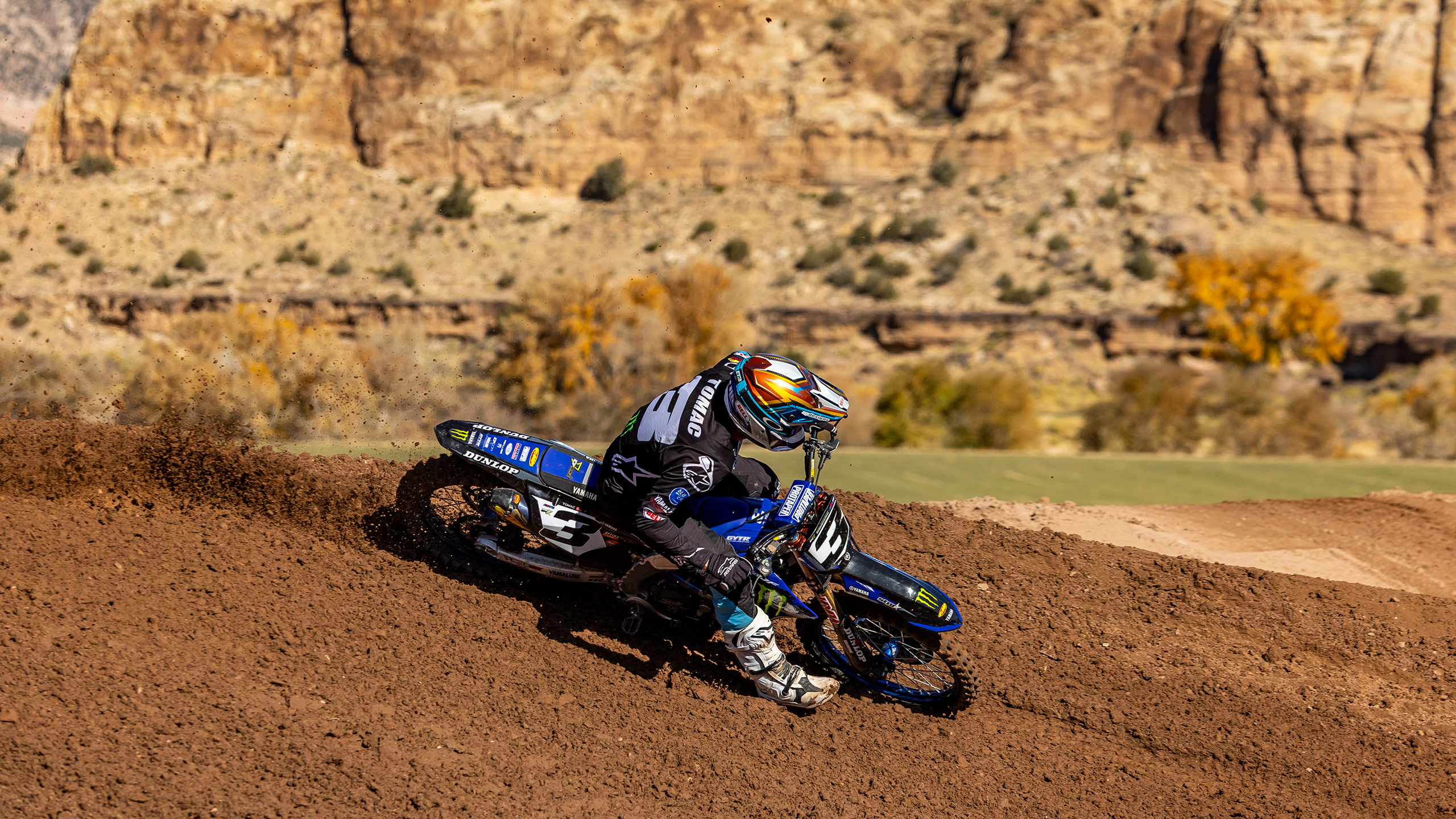 Eli Tomac riding dirt bike creating roost